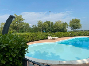 Appartamento Il Faro con giardino in Residence con piscina
